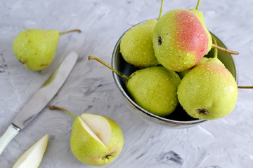 Fototapeta na wymiar Healthy Organic Pears in Bowl Gray Background Autumn Harvest