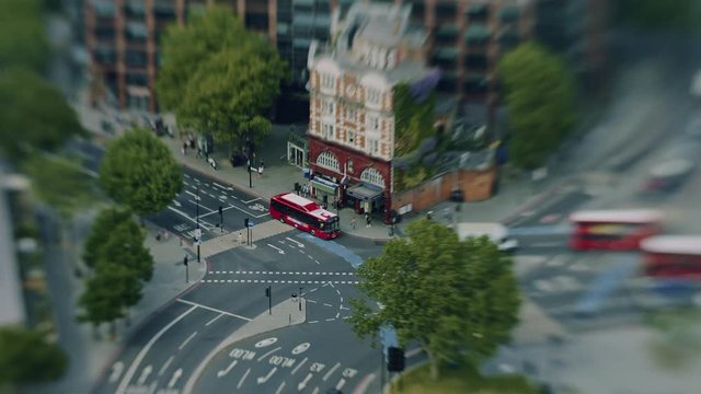 Timelapse of traffic outside Elephant and Castle Underground station in London from above. Tilt shift miniaturising effect.