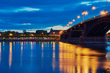 Theodor-Heuss bridge of Mainz in the blue hour with light reflection and part of Mainz castle