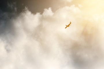 The plane flies in the clouds