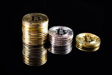 Gold bitcoin on black background