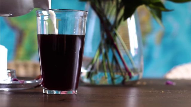 this clip shows milk being poured into a glass filled with coffee, you can really follow the nice flow in 40% slowmotion