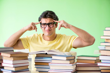 Student with too many books to read before exam