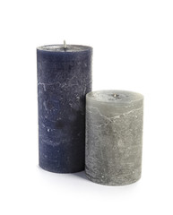 Two decorative wax candles on white background