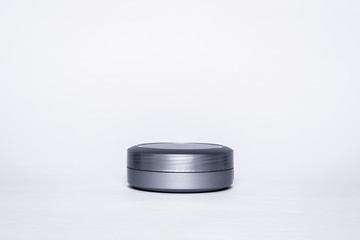 Gray box for cream, gel. Isolated on white background box, ready to be filled with content.