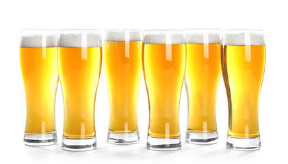 Glasses of beer on white background