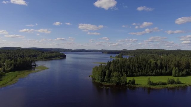 Long forward moving drone shot of a lake in the Karelian countryside