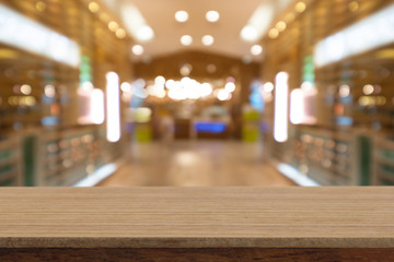 Perspective empty white wooden table on top over blur background, can be used mock up for montage products display or design layout.