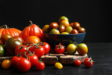 Naklejka na ściany i meble Composition with tasty juicy tomatoes on table