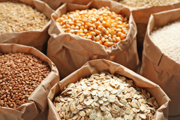 Bags of different cereal grains, closeup