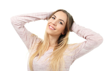 Fototapeta premium Beautiful smiling woman posing against white background