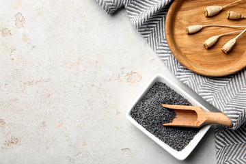 Flat lay composition with poppy seeds on grey background