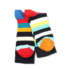 Colorful socks on white background, top view