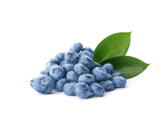 Heap of fresh ripe blueberries on white background