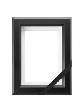 Funeral photo frame with black ribbon on white background