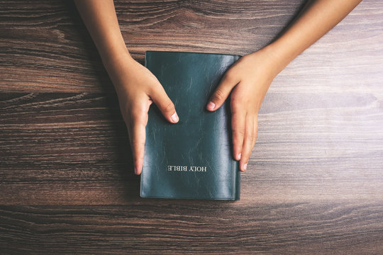 Hands Holding Holy Bible