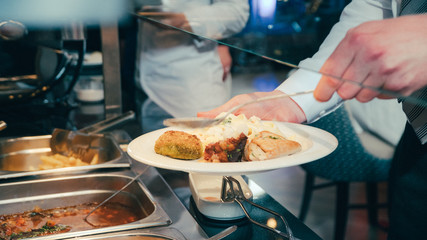 buffet: people take food in plates.