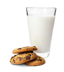 Tasty cookies with chocolate chips and glass of milk on white background
