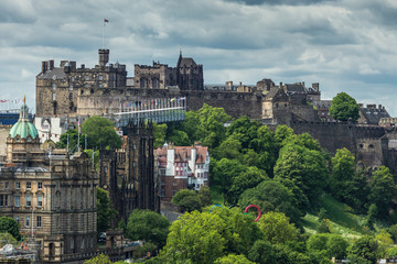 Edinburgh, Scotland, UK - June 13, 2012: Looking from Calton Hill upon dark brown castle and...