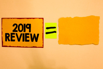 Writing note showing 2019 Review. Business photo showcasing seeing important events or actions that made previous year Orange paper notes reminders equal sign important messages to remember.