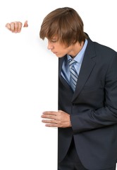 Young male in business suit with invisible object