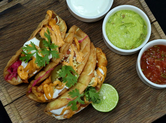 mexican tacos on a wood board