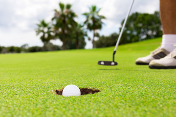 close up of putting a golf ball