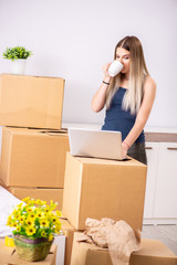 Fototapeta premium Young woman moving to new place