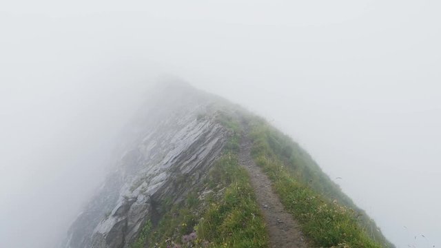 ridge walk during really bad weather dangerous mountain hike in the swiss alps brienzer rothorn