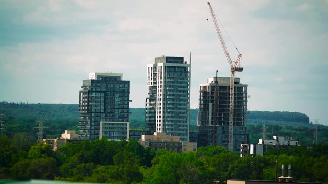 Buildings under construction during summer in Burlington Ontario with heat waves visible