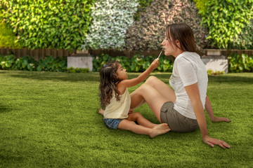 Fototapeta premium Mother and daughter makeup play time.