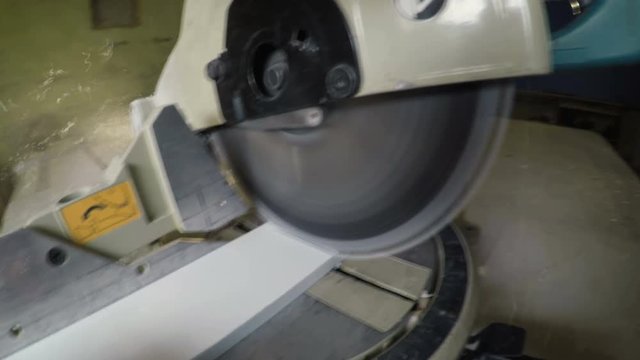 A Large Round Saw at the Factory Goes down and Saws a Tree on Gopro 4K