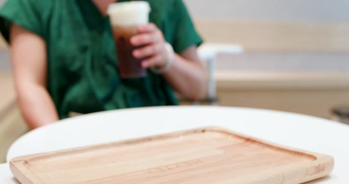 Family drinking of iced tea at Heytea store in the city