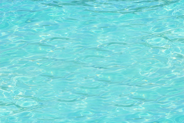 Sea clear water surface of PP island with sun reflections.