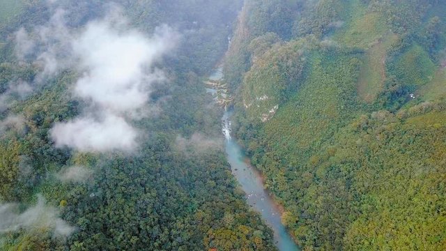 Flying over the Cahabon River and jungle at Semuc Champey, Guatemala, AERIAL