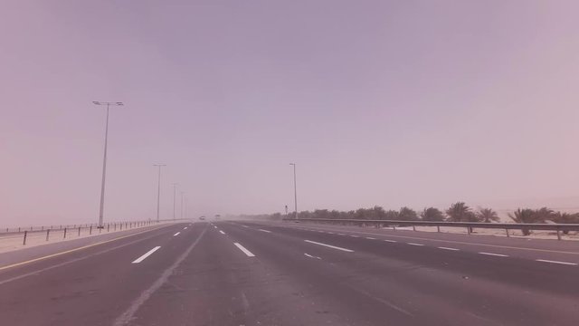 Sandstorm sweeps the sand on highway stock footage video