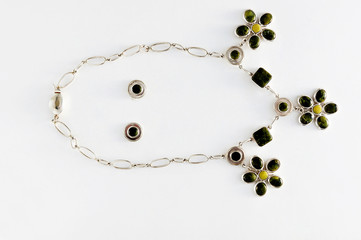 Closeup, necklaces with colored stones, jewelry. Woman.