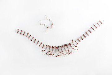 Closeup, necklaces with colored stones, jewelry. Woman.