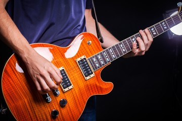 Fototapeta na wymiar Closeup of a Musician Playing an Electric Guitar