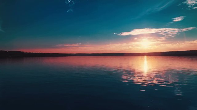 Aerial View: Colorful Sunset. Flying Over The River.