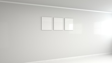 Blank white poster in white frame on the wall