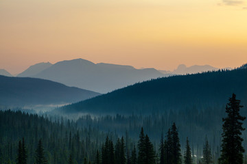 Fototapeta na wymiar Break of Dawn With Mountain Silhouette in Banff National Park