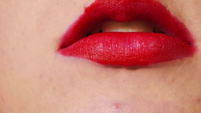 Woman smoking cigarette, Extreme closeup on red lips and yellow teeth
