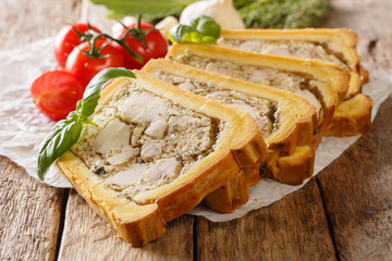 Chicken terrine in bread sliced into pieces close-up. horizontal