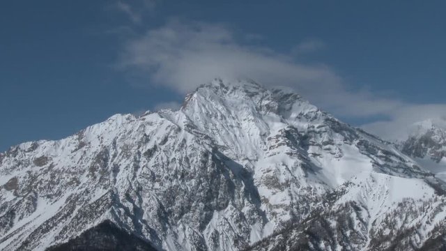 Timelapse of Mount Chaberton, 3130 mt. with clouds on the top. Alps, Italy. Winter. Timelapse
