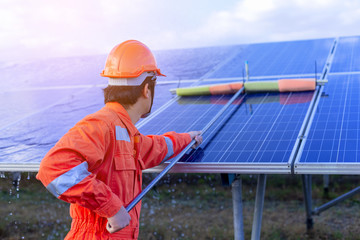 Engineers are checking the solar panel for maintenance. And clean the solar panel is always...