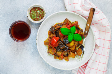 Caponata is a traditional Sicilian dish. Stew of vegetables-eggplant, tomatoes, onions, Basil and olives with seasonings and spices