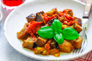 Caponata is a traditional Sicilian dish. Stew of vegetables-eggplant, tomatoes, onions, Basil and olives with seasonings and spices