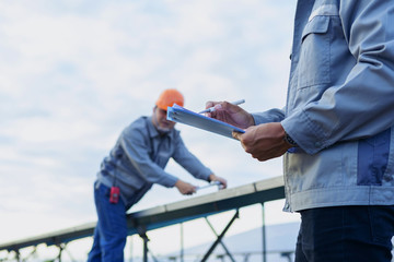 Engineers are checking the solar panel for maintenance. And clean the solar panel is always...