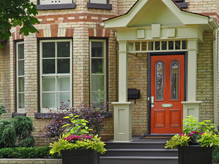Fototapeta na wymiar front door of Victorian house with multicolored brick